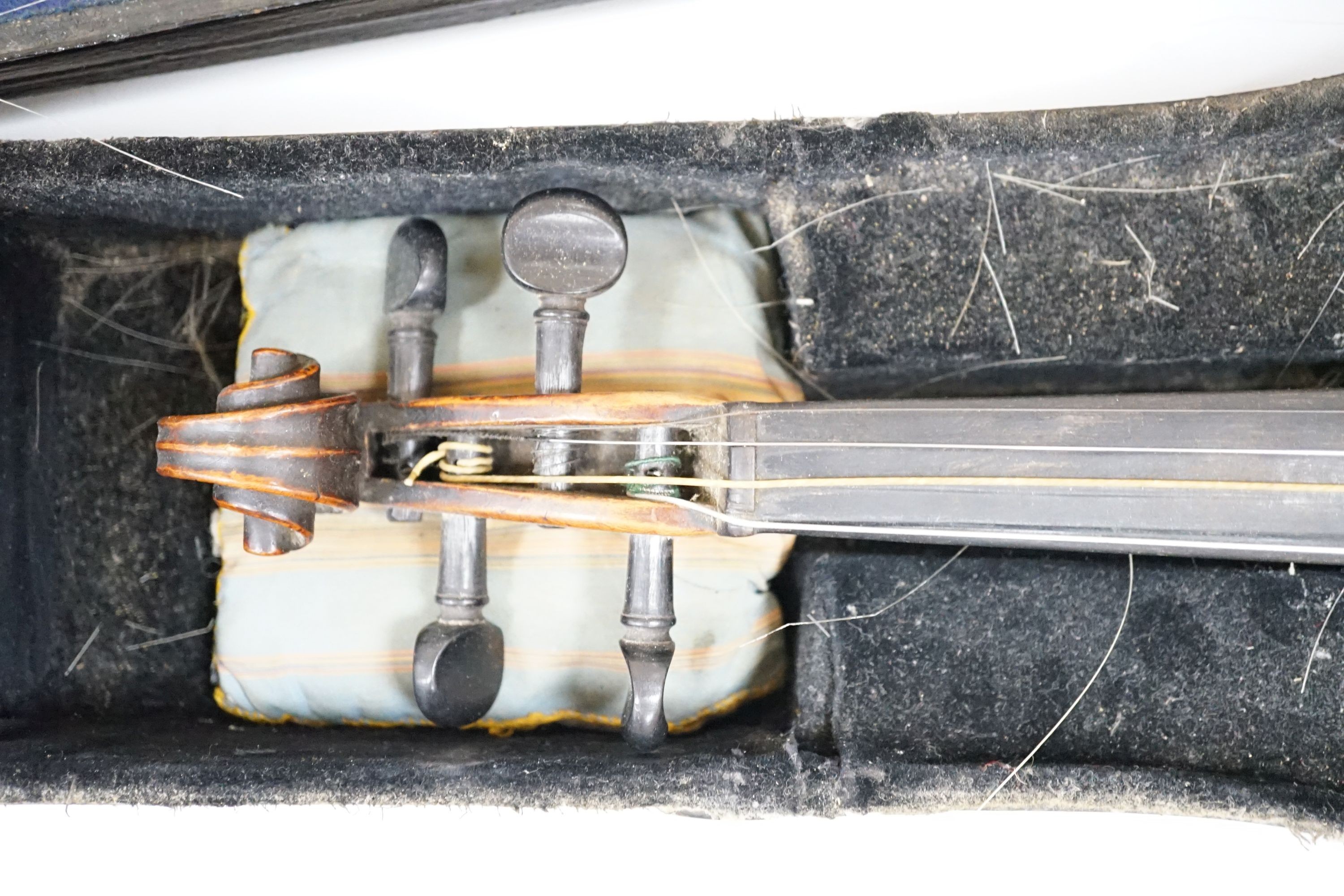 A 19th century 3/4 size violin, cased with 2 bows and 1 other German violin